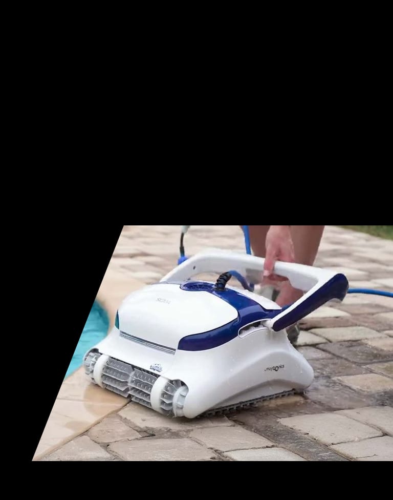 Pool owner holding the floating cable of a corded Dolphin robotic pool cleaner