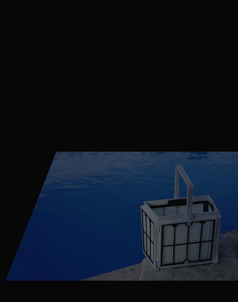 Dolphin MaxBin top-loading filter basket held beside a swimming pool