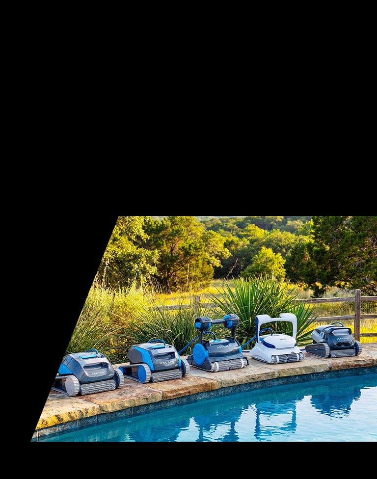 Lineup of Dolphin robotic pool cleaners on a pool deck